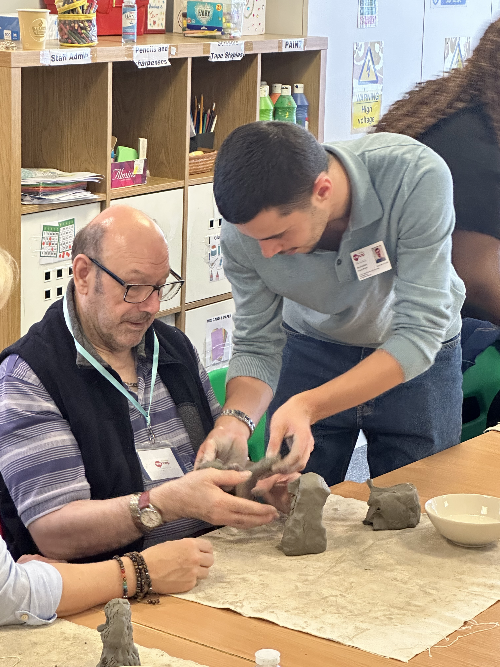 Joe and client cotmandene Photograph of our service user Peter Burstow (left) and staff member Joe Stapleton (right) enjoying a sculpture workshop.