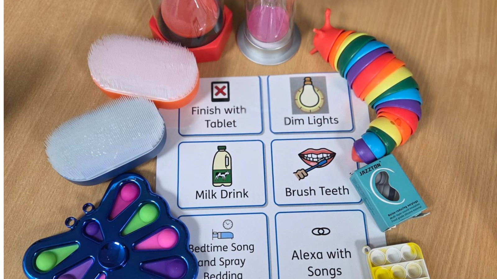 Copy of Press Release (Twitter Post) (1) A number of sensory support items including a visual schedule showing a step-by-step routine, fidget toys and a sand timer.